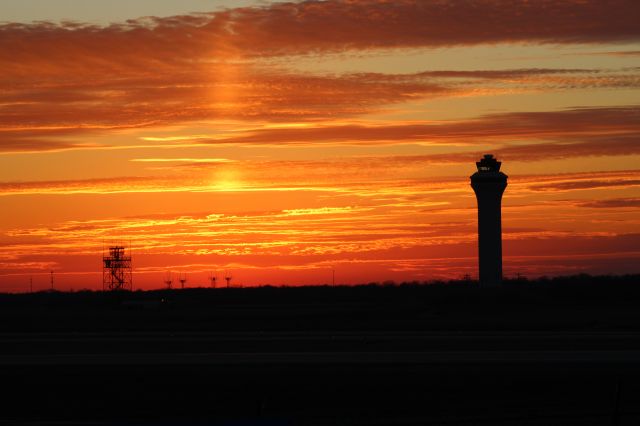 — — - Sunset behind the KCVG tower and radar.