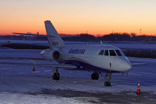 Dassault Falcon 20 (N148TW) - An Ameristar Falcon Jet on the Grand Aire ramp on balmy 11 deg F/wind chill of 5 deg F just before sunrise, 25 Jan 2022.