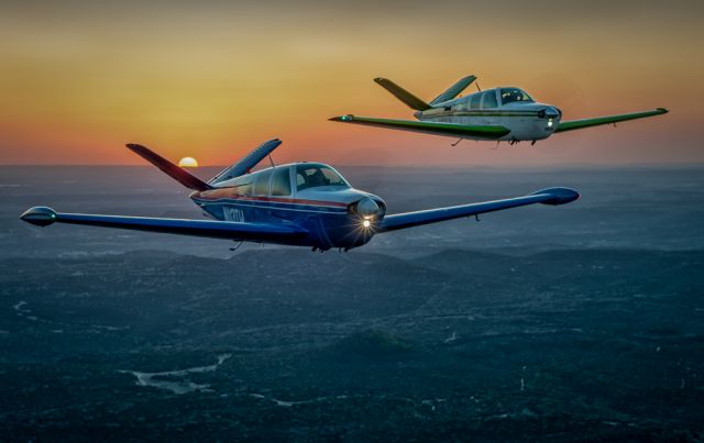 Beechcraft 35 Bonanza (N113TW) - N113TW and N61JL Cruising the Texas Hill Country at Dusk..Photography by Glenn Watson of Mach Point One Aviation.