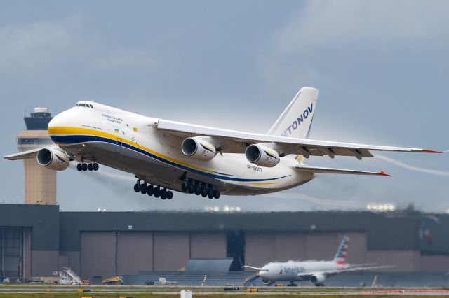 Antonov An-124 Ruslan (UR-82007) - The crew of Honolulu-bound ADB3845 Heavy release the brakes and advance the four Progress D-18T turbofans to take off thrust, leaving a massive trail of thick exhaust behind it.