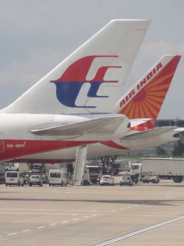 Boeing 747-400 — - Two Boeing 747s at London Heathrow Airport