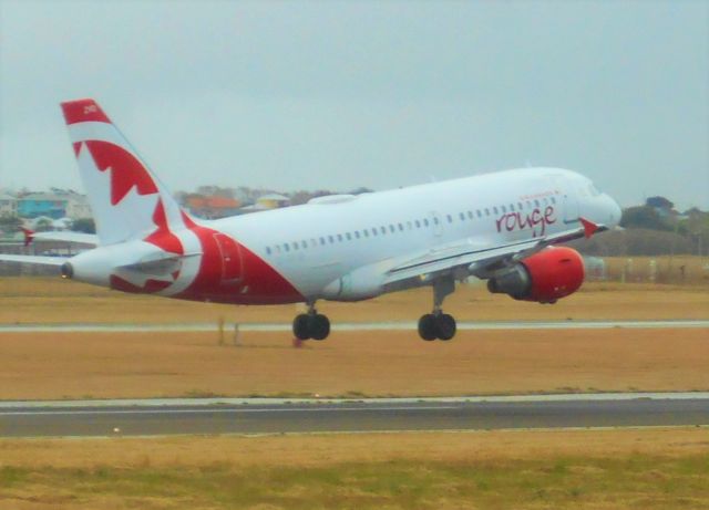 Airbus A319 (C-GSJB) - Landing at TBPB. Sorry for the lack of clarity! had a digital camera that goes soft after zoomed in so thats the reason!