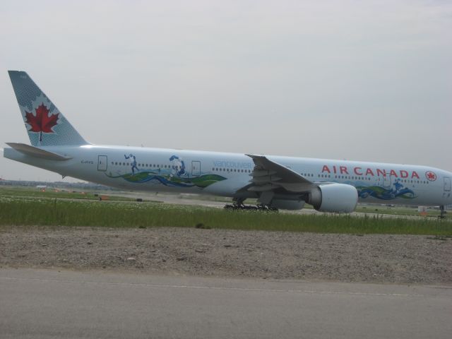 BOEING 777-300ER (C-FIVS) - Air Canadas last delivered 777-300ER in Vancouver 2010 Olympics Livery Taking off rwy23 at Toronto