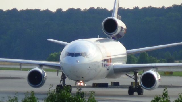 McDonnell Douglas DC-10 (N385FE) - FedEx 765 arriving from Memphis at 6;56 P.M.   Taken June 7, 2015.