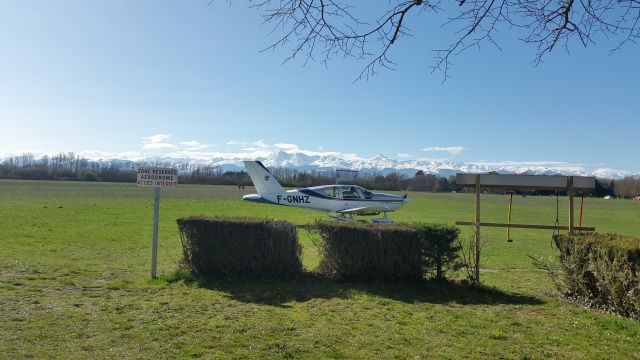 Socata TB-9 Tampico (F-GNHZ) - A Socata Tampico of Aréoclub de Bigorre flight school, France, against le backdrop of majestic Pyrenees cordillera 