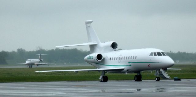 Dassault Falcon 900 (N889TD) - Shortly after arriving is this 2007 Dassault Falcon 900EX in the Summer of 2022 while a Skywest Regional Jet arrives on this rainy day the Spring of 2022.