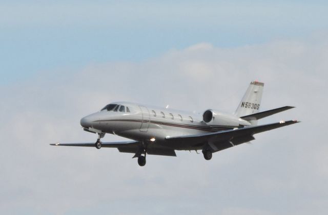 Cessna Citation Excel/XLS (N583QS) - Shown here in the winter of 2015 is this Citation Excel a moment or two from landing.  