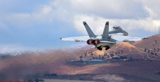 McDonnell Douglas FA-18 Hornet (16-8928) - Caught the gear in transit to the wells in this shot of a VFA 94 "Mighty Shrikes" Super Bug on a sunset hour a/burner departure from Reno Tahoe International's 34R.br /CDR Matt "Lick" Morgan was up front and CDR Nick "Kooter" Smetana was in the back seat.br /br /***  ADDED (7/11/2019) >>  This was NOT an afterburner departure.  To learn why my info (above) is incorrect, scroll down to read the Comment by Skylab72. ***