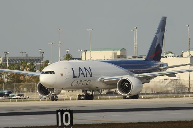 BOEING 777-200LR (N776LA) - LAN Cargo flight 1107 to Amsterdam taxiing for takeoff from RWY 9. Taken from just east of El   Dorado Furniture. 3/31/13