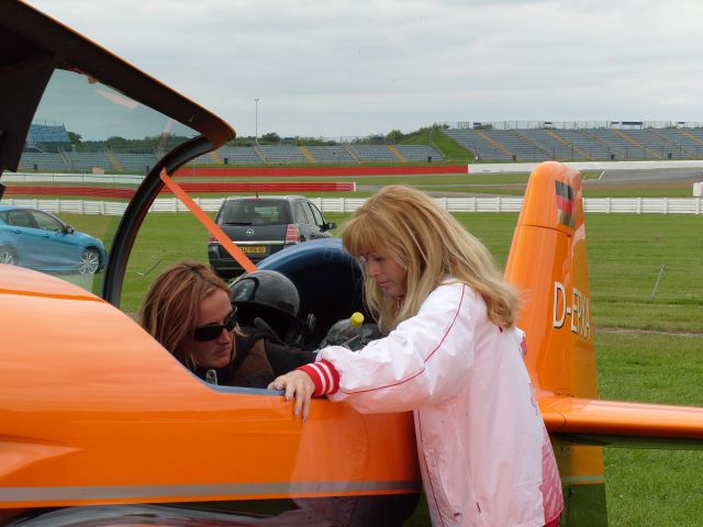 D-EPXA — - EGBV is Silverstone, England. Type is XtremeAir Sbach 300. Photo taken on 18AUG2009. c/n 007. Privately owned. Kathel Boulanger of the French team and Svetlana Kapanina of the Russian team inspect the controls of the Xtreme Air Sbach 300 of the German team prior to commencement of the World Aerobatic Championships (WAC) 2009. Svetlana is in the cockpit.