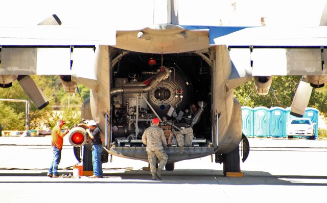 Lockheed C-130 Hercules (93-1563) - A MAFFS C-130 from the 145th Airlift Wing, Charlotte, North Carolina Air National Guard receives some attention while the Ponderosa Fire suspended air ops for the morning. Note the MAFFS retardant nozzle being worked on to the left.