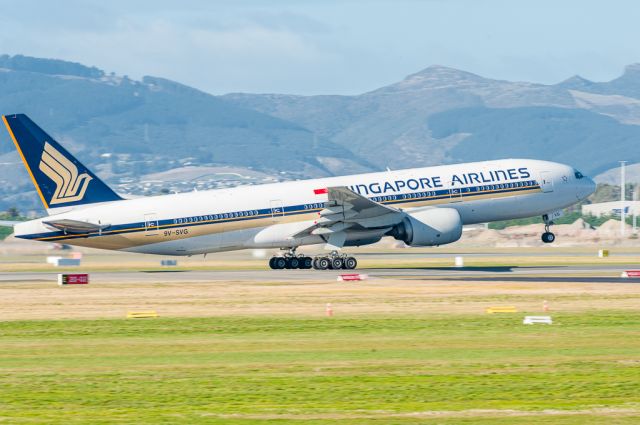 Boeing 777-200 (9V-SVG) - Singapore Airlines Flight 298 rotating on Runway 20 at Christchurch International Airport, bound for Singapore on a lovely sunny winters morning on Monday 25 July 2016. The hill suburb of West Moreland is in the background, and Marleys Hill on the left, which forms the western side of the Lyttelton Harbour volcano.