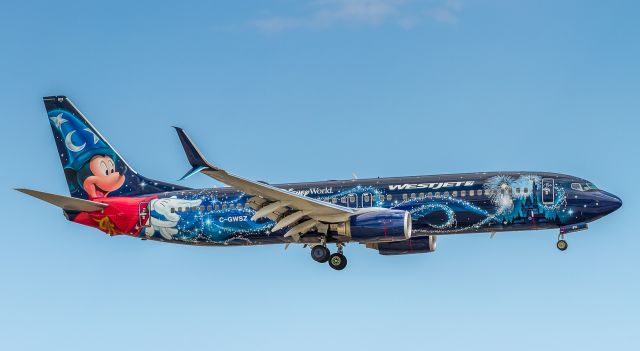 Boeing 737-800 (C-GWSZ) - Westjet Mickey arrives from Calgary as WJA662. Despite the fact this is one of my hometown airlines, this is one stunning livery!