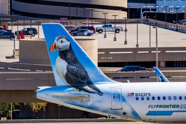 Airbus A320neo (N322FR) - A Frontier Airlines A320 neo "Captain the Puffin" taxiing at PHX on 2/10/23 during the Super Bowl rush. Taken with a Canon R7 and Canon EF 100-400 II L lens.