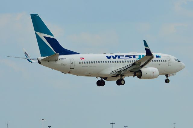 Boeing 737-700 (C-FWAF) - WestJet C-FWAF B737-700 Arriving KDFW 07/28/2013