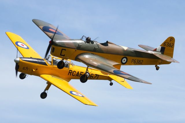 G-AJRS — - Miles Magister, in the foreground and a de Havilland Chipmunk in the background, perform a formation flypast at Old Warden Aerodrome.