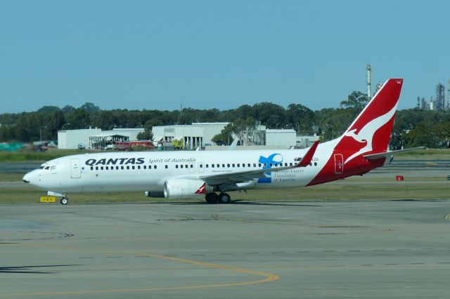 Boeing 737-800 (VH-VZO) - 6th August 2015: Qantas B 737-838 with special marking at the rear fuselage taxiing after landing at Brisbane airport.