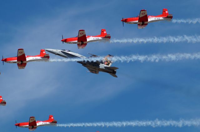 McDonnell Douglas FA-18 Hornet (J5011) - Swiss Air Force F18 on close formation with PC-7s