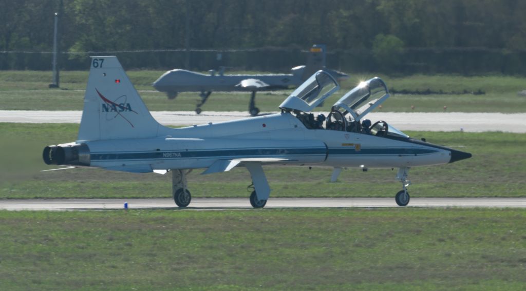 Northrop T-38 Talon (N967NA) - NASA967 taxis for takeoff with a MQ-9 Reaper drone in the background.