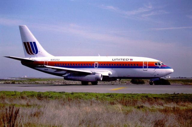 Boeing 737-200 (N9025U) - KSFO - Feb 1988 filming from the dirt parking lots next to Airport Rd by  the Runway 1LR departure area, this Denver bound 737 set to depart SFO. Boeing LN 62  delv new Sep 4th, 1968.