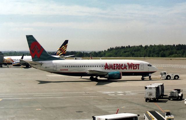N335AW — - KSEA - America West 737 300 on the push back - ready for departure to KPHX.