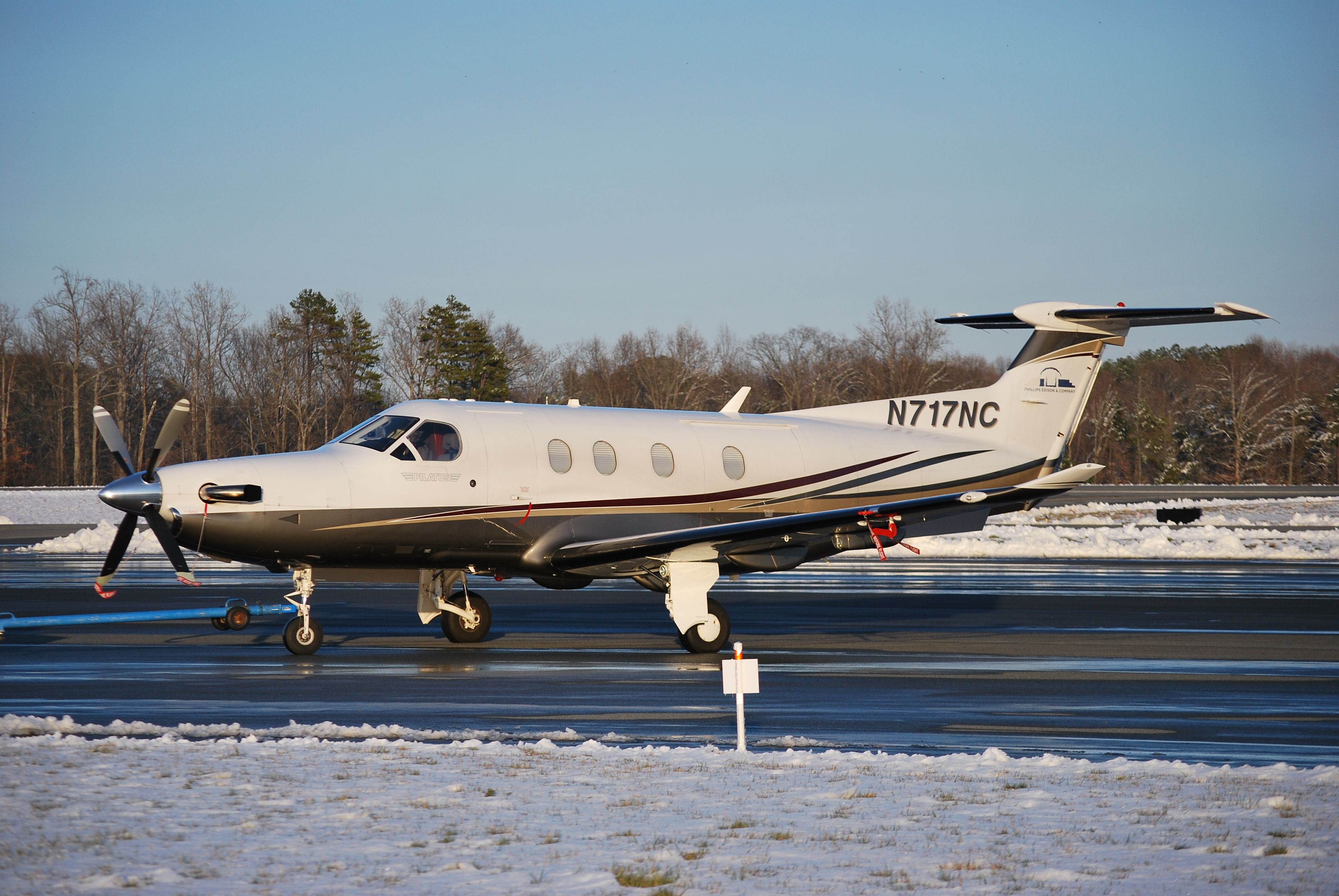 Pilatus PC-12 (N717NC) - PECO AVIATION LLC being towed at Concord Regional Airport - 3/2/09