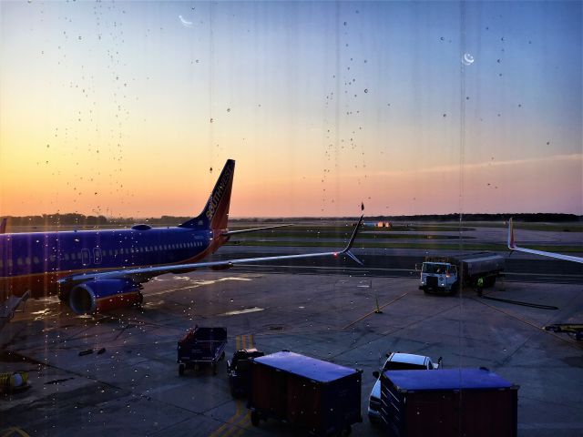 Boeing 737-800 (N8637A) - Sunrise after a rainstorm in Concourse C at BWI