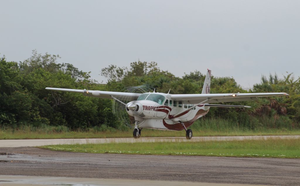 Cessna Caravan (V3-HHE) - Takeoff at Placencia Airstrip.