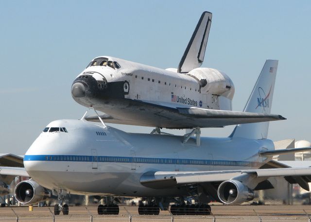 Boeing 747-200 (N911NA) - About to take off from Barksdale Air Force Base, Louisiana on the way home to Florida. Seeing these two aircraft, this close up, was amazing!