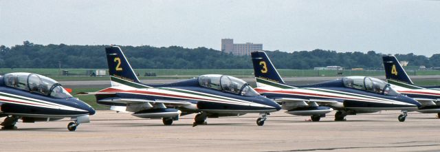 AERMACCHI MB-339 — - McGUIRE AIR FORCE BASE, WRIGHTSTOWN, NEW JERSEY, USA-AUGUST 1986: Performing at the August 1986 Open House and Air Show was the Italian Air Force Aerobatic Team "Frecce Tricolori" (Three-Colored Arrows). 