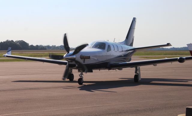 Daher-Socata TBM-900 (N615TX) - A Socata TBM900 cranked up and beginning to taxi down the ramp at Pryor Field Regional Airport in Decatur, AL September 6, 2016. Shot using the Canon T5 in sports mode with the 75mm-300mm lens from the grass at the edge of the ramp nearest the terminal.