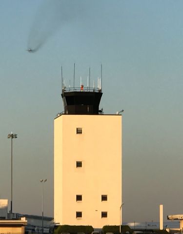 McDonnell Douglas MD-88 — - Greenville-Spartanburg International Airports control tower with the unmistakable smoke trail of an MD-88 taking off.