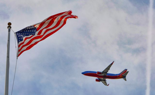 Boeing 737-700 (N7714B) - SWA climbing out over Fort Independence.