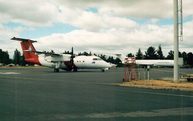 — — - Dash 8 at Hobart.br /In the background is a Boeing B727 Freighter.