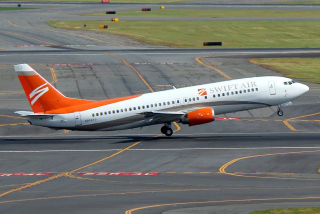 BOEING 737-400 (N804TJ) - Swift Air 141 departing to Tampa after bringing in the Tampa Bay Raysbr /br /br /KBOS    Logan