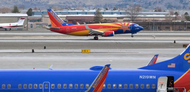 BOEING 737-300 (N383SW) - Snapped exactly 24 hours ago, this click captures the mains of SWAs "Arizona One" (N383SW) making first contact with the concrete as the special scheme 737 arrives from PHX at high noon yesterday.