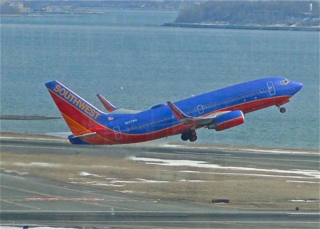 Boeing 737-700 (N297WN) - Gear-up for this Southwest 737-700 just after rotating off of 22L at KBOS. Shot this from the tower.