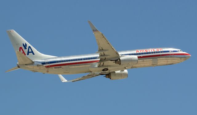 Boeing 737-800 (N936AN) - Americans N936AN climbs away from Reno-Tahoe Internationals runway 16R and up into a cloudless early afternoon sky for a flight to KORD.