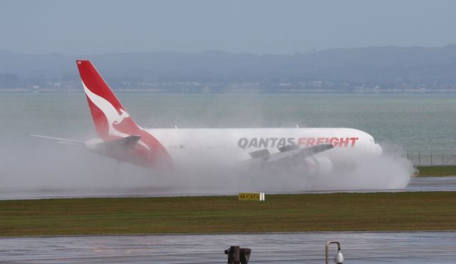 BOEING 767-300 (VH-EFR) - Taken in Auckland from the top level of the car park just after a massive down pour.