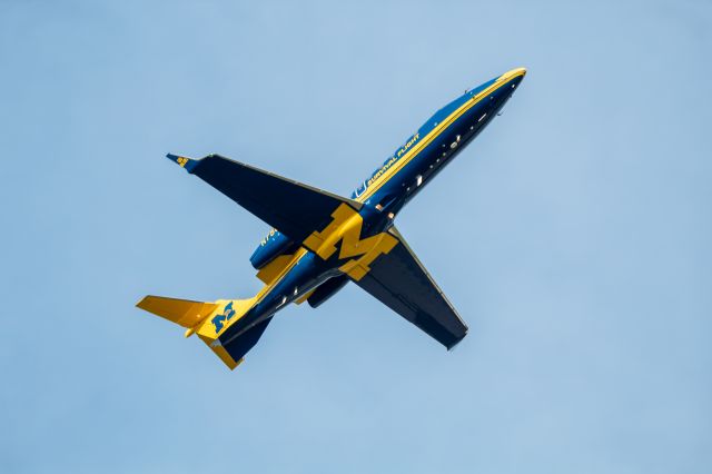 Bombardier Learjet 75 (N75UM) - University of Michigan Learjet 75 climbing off 23R bound for Chicago-Midway after receiving a transplant.