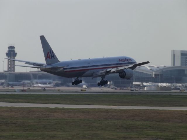 Boeing 777-200 — - Took this picture at founders plaza off Runway 18R.