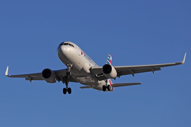 Airbus A319 (N8009T) - Deep blue skies above AAL2021, on final for RWY 24R from Charlotte/Douglas Intl (KCLT) this fine Monday morning (8 Nov 2021).