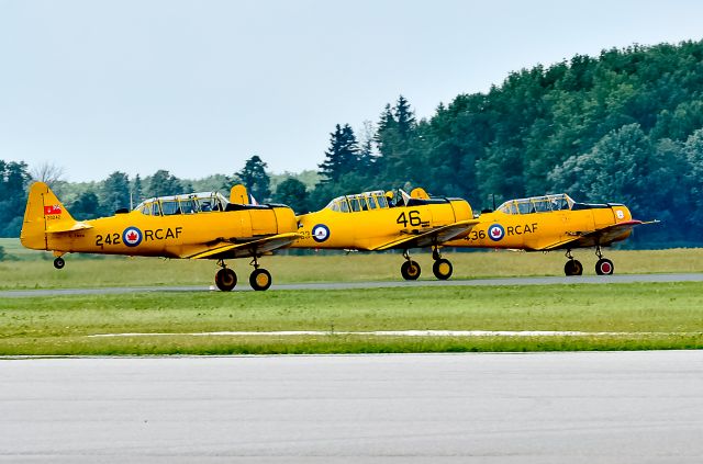 — — - AT-16 Harvard II x 3 take off