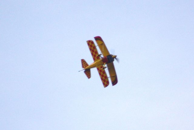 N703WT — - While waiting on N54GP to arrive to KDTN, we got a private airshow from this pilot.  He put on an amazing show.  He is banking to go vertical and into a stall and nose slide, in this shot.  He or she is very talented.