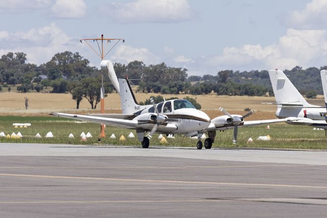 Beechcraft 55 Baron (VH-DBZ) - Beech 95-A55 Baron (VH-DBZ) taxiing at Wagga Wagga Airport.