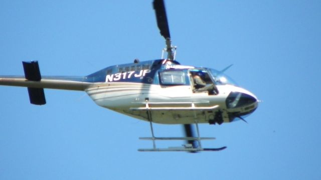 Bell JetRanger (N317JP) - Aircraft operated by Jacksonville Sheriff's Office.  Photo taken 18Apr2013 at 1220 PM (EDT) while actively in use for surveillance of a person of interest who was using Atlantic Beach marshlands as cover to avoid detection and apprehension.