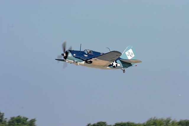 — — - SB2C Curtis Helldiver Departs EAA for Home