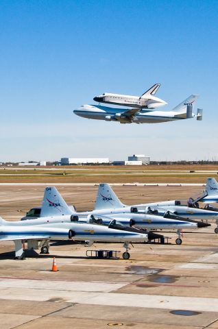 — — - One of Two NASA Shuttle Carrier Aircraft Performing Flyby