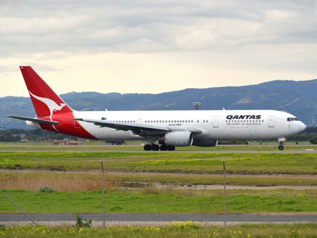 BOEING 767-300 (VH-ZXC) - On taxi-way heading for take off on runway 05, for flight to Sydney. Thursday 12th July 2012.