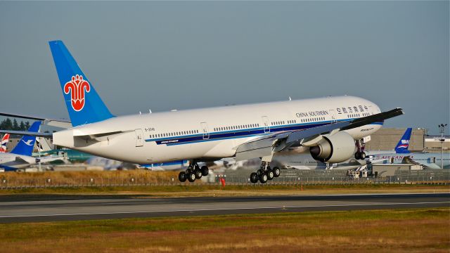 BOEING 777-300 (B-2048) - BOE397 on short final to Rwy 16R to complete an evening flight test on 7/17/14. (LN:1219 / cn 43220).